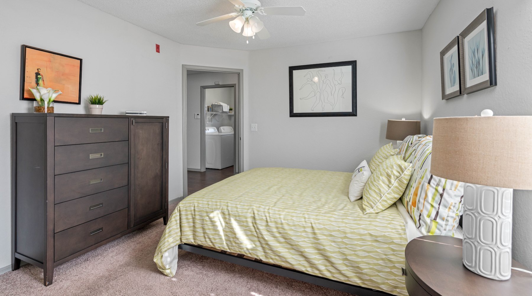 a bedroom with a bed and a dresser