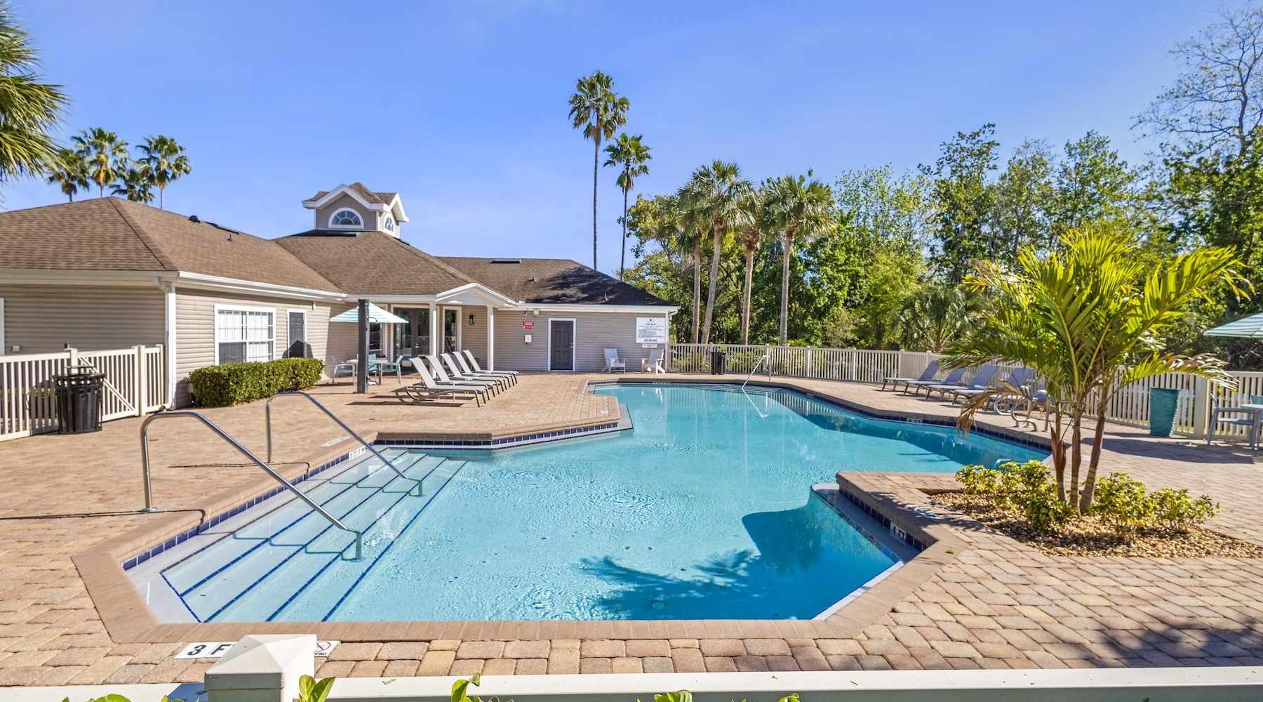 a swimming pool in front of a building